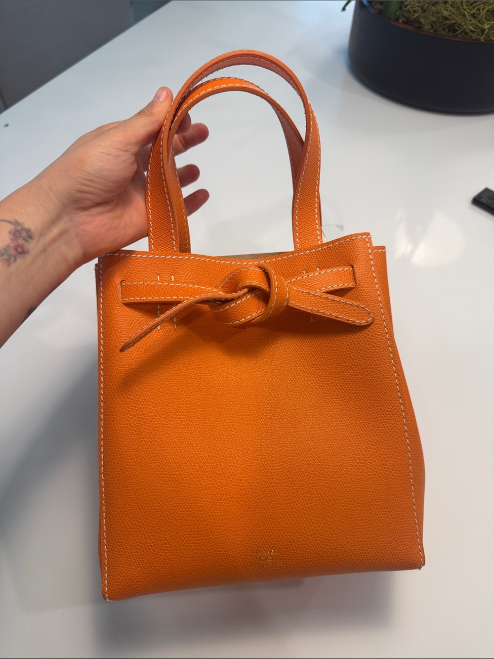 Harper lawrence Orange Leather Knot-Top bag